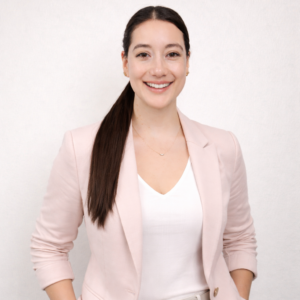 Professional headshot of Alejandra Pardo Lopez, Marketing Manager at PL Bioscience, smiling in a light pink blazer and white top against a neutral background.